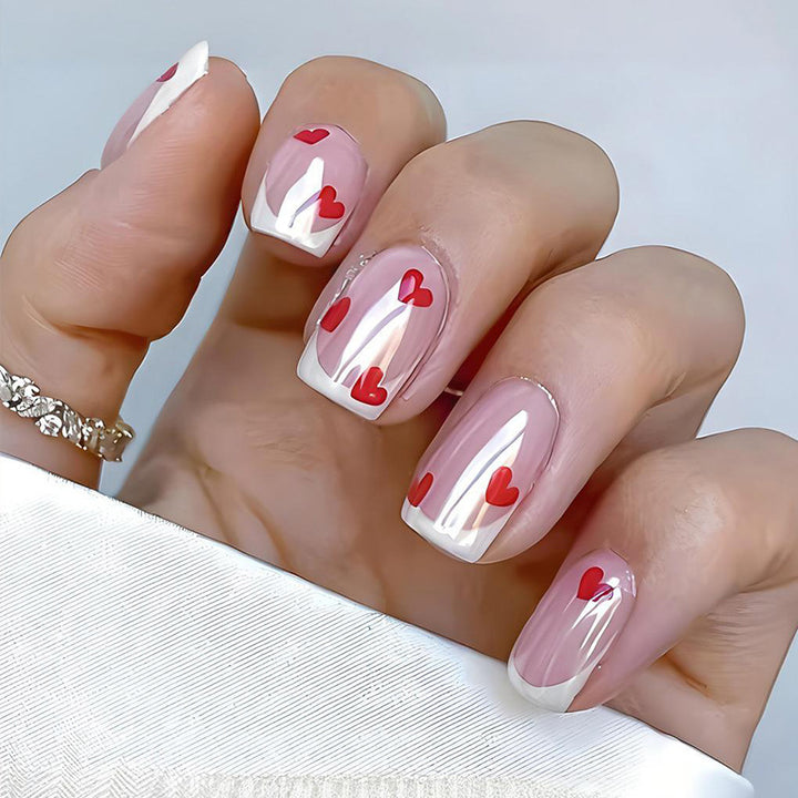 Acrylic nail set with romantic hearts and elegant French tips Stornfield