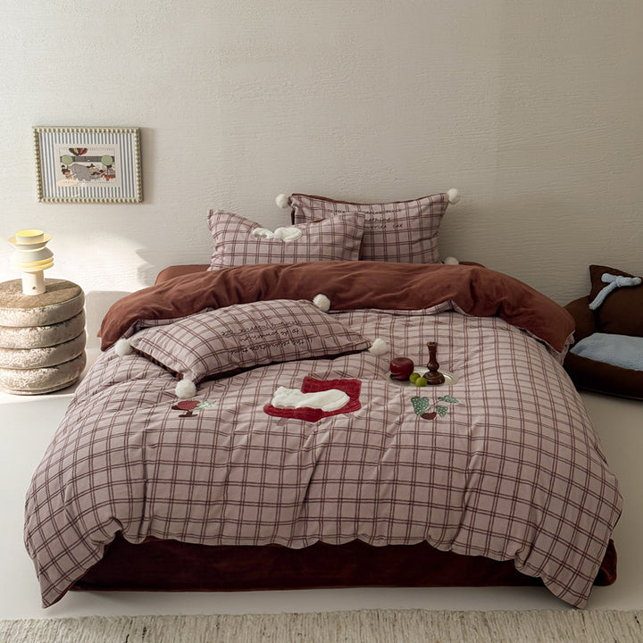 Plush bedding set with embroidered dog motif and striped cuddle blanket