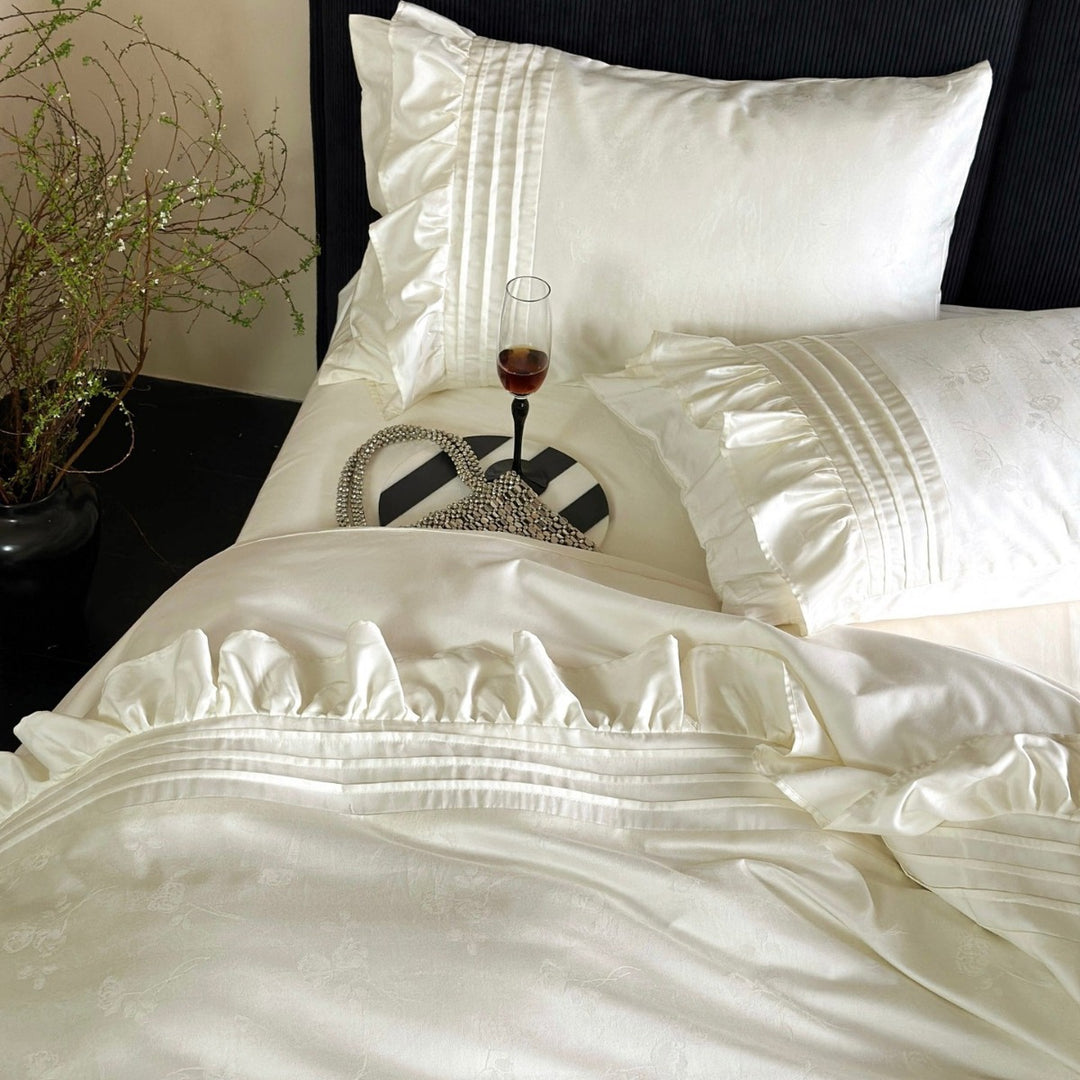 Luxurious satin bedding set with ruffles and delicate floral embroidery