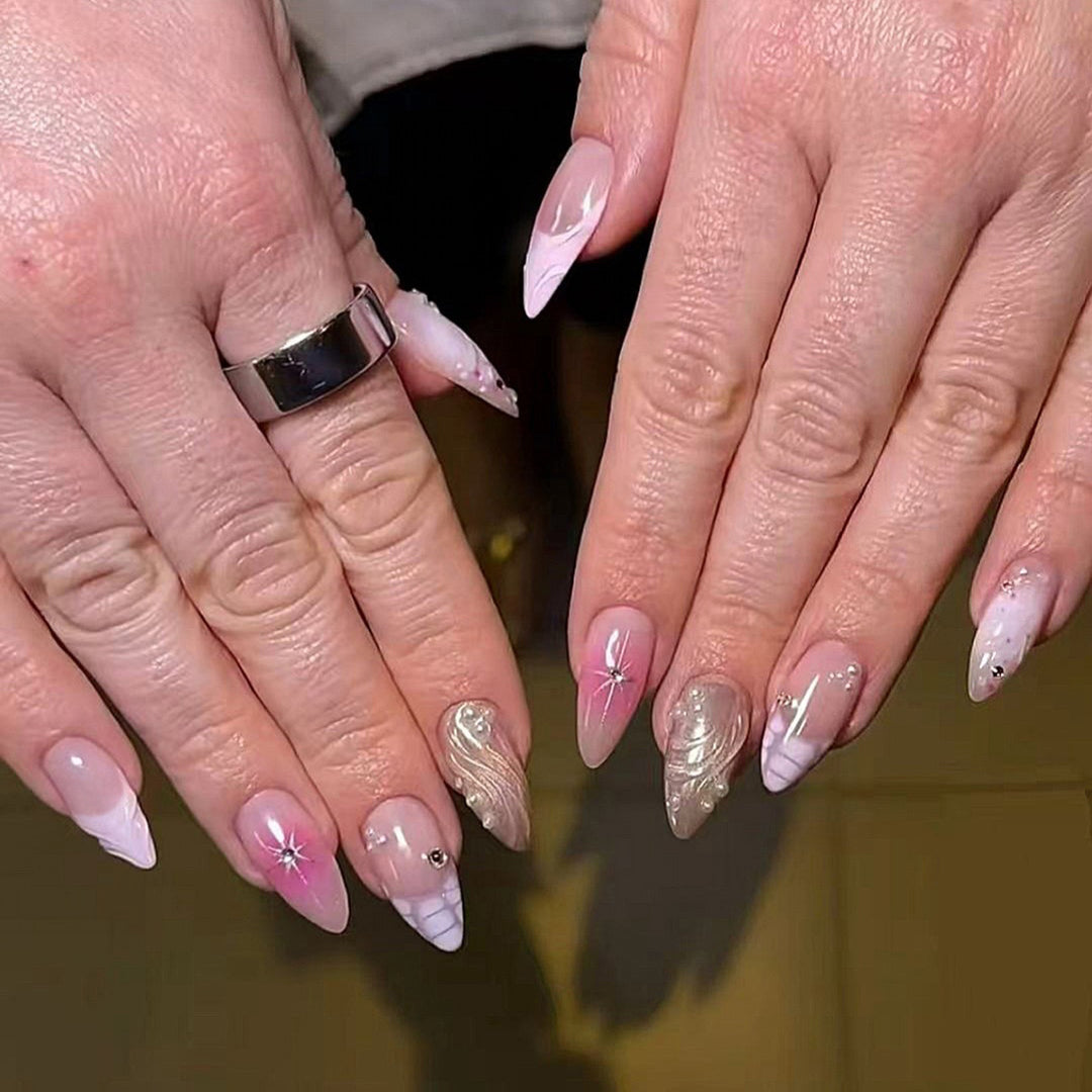 Artful Nail Extensions with Glitter and Shell Motifs Stornfield