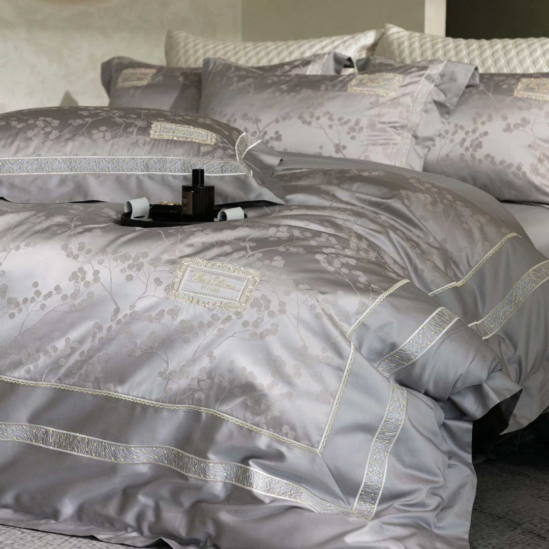 Luxurious satin bedding with jacquard floral pattern and lace trim