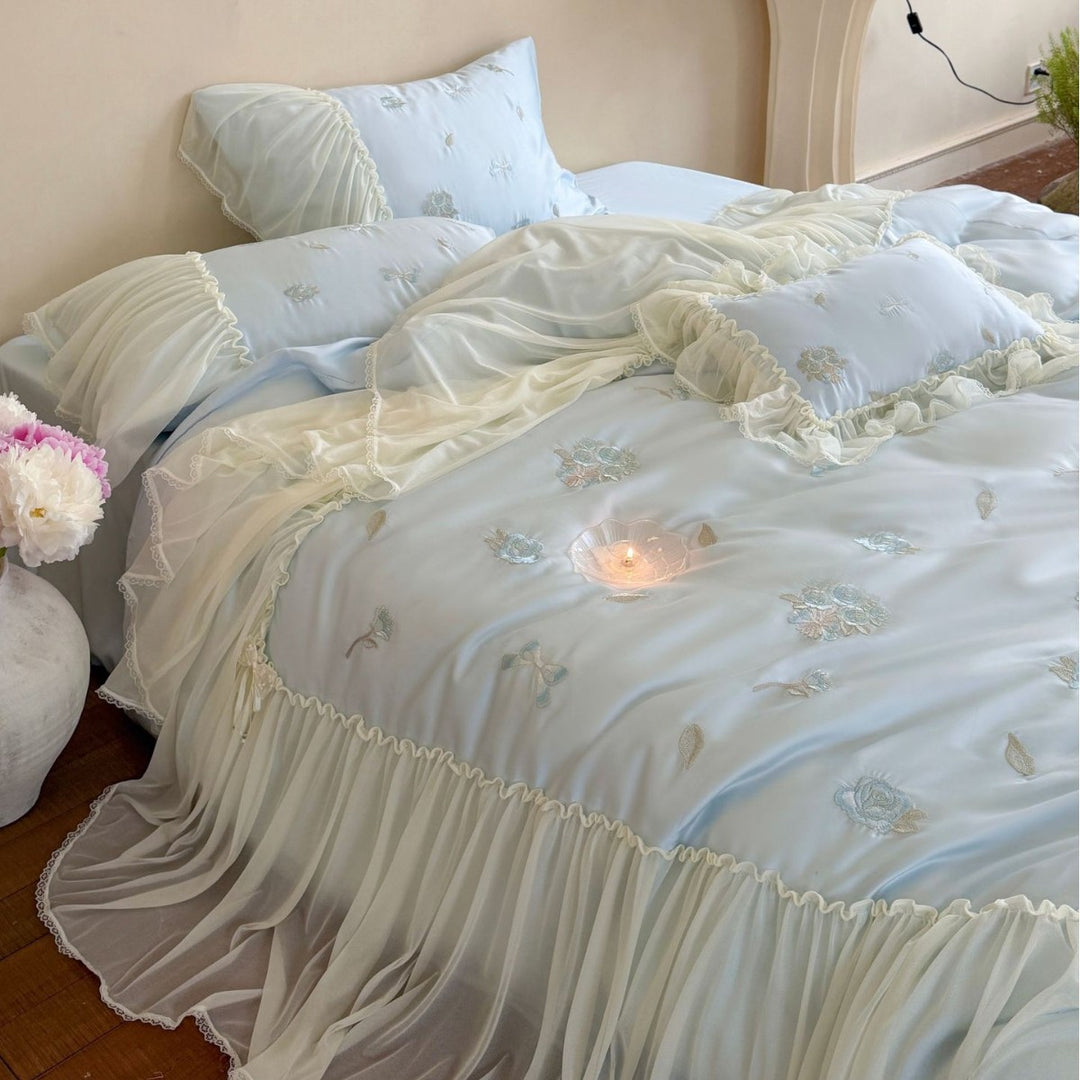 Romantic embroidered bedding set with ruffled frill and tulle overlay
