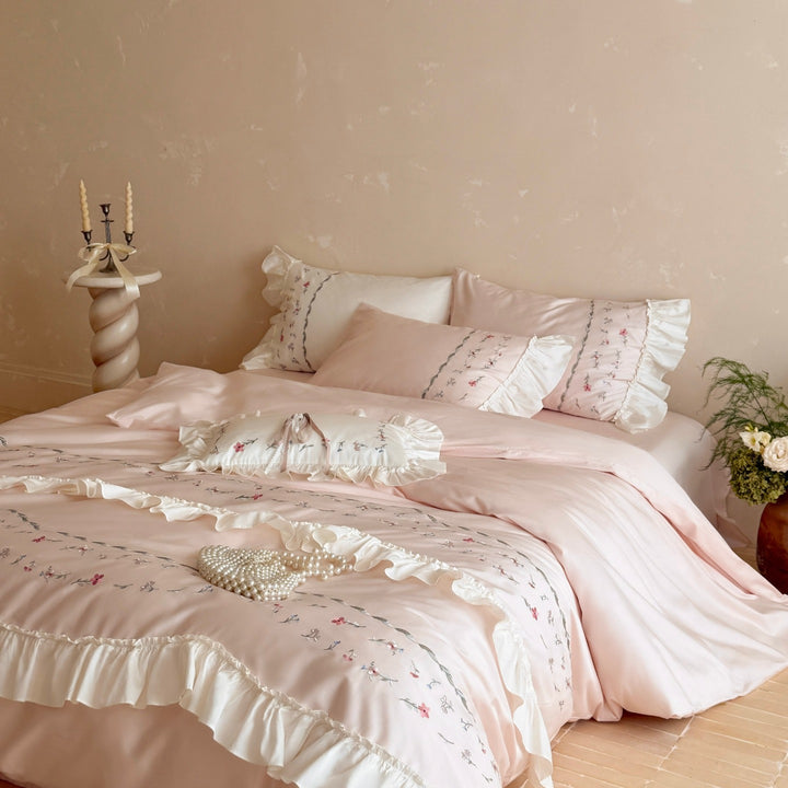 Romantic bedding set with ruffles and floral embroidered cotton satin