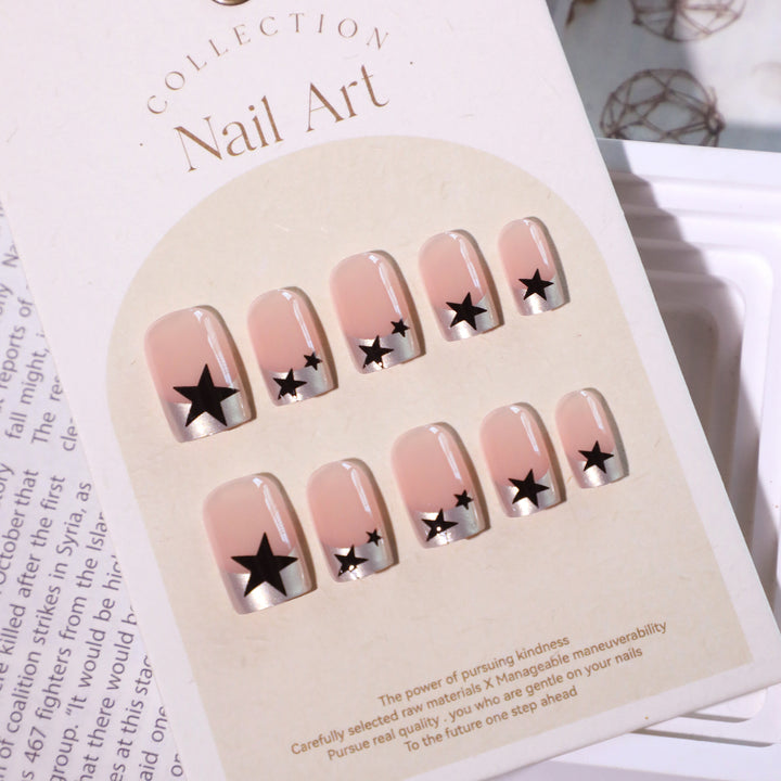 Sparkling nail art with stars and glitter accents Stornfield