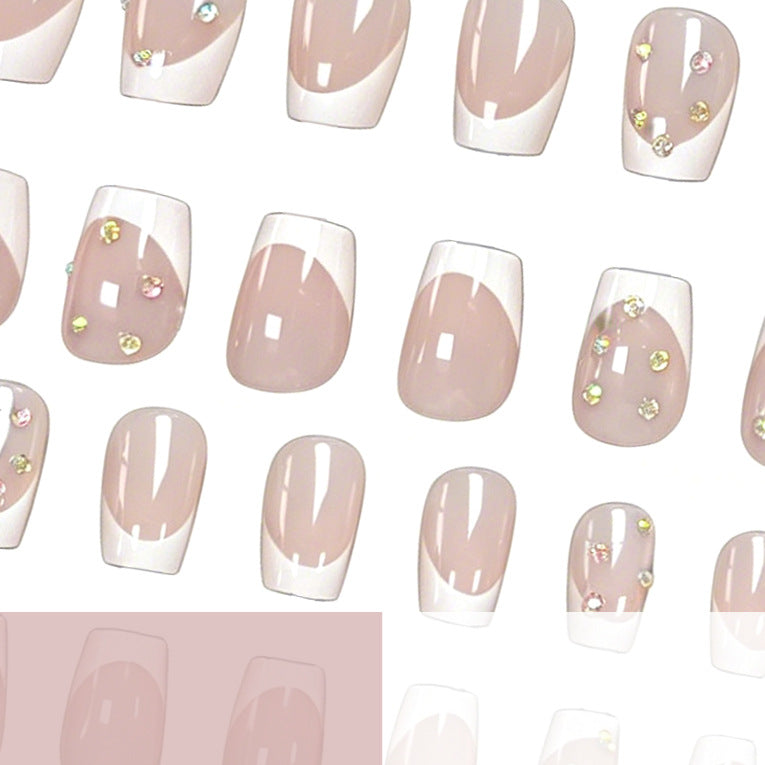 Elegant French Tip Nail Art Enhancements with Gem Accents Stornfield