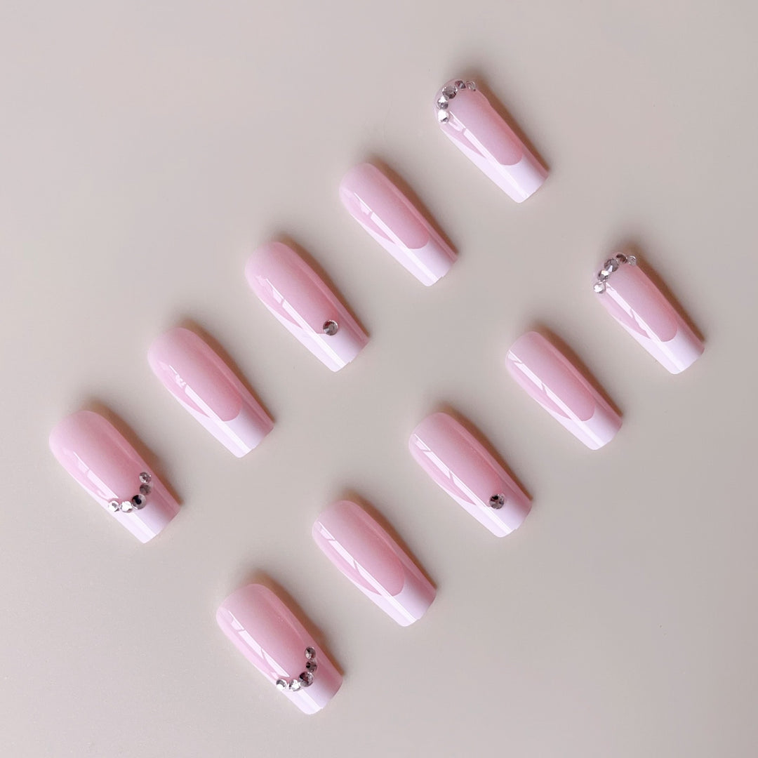 Acrylic nail set with elegant high-gloss finish and luxury rhinestone embellishments Stornfield