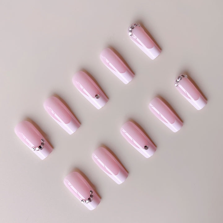 Acrylic nail set with elegant high-gloss finish and luxury rhinestone embellishments Stornfield