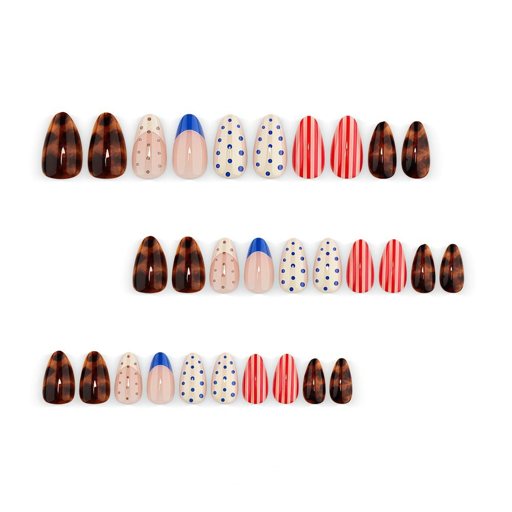 Fake nails in playful design with dots and stripes Stornfield
