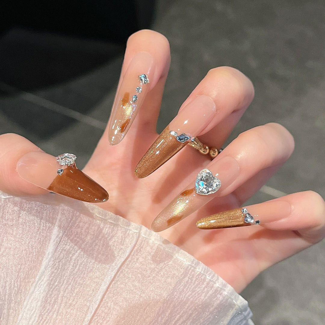 Artistic Stiletto Press-On Nail Art with Glimmering Accents Stornfield
