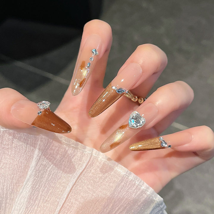 Artistic Stiletto Press-On Nail Art with Glimmering Accents Stornfield