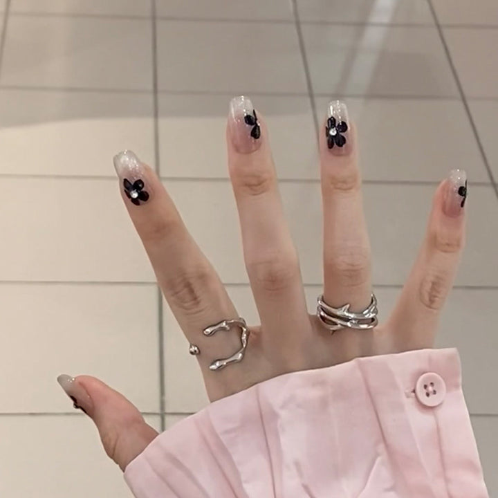 Artificial nail set with elegant flower design and glamorous accents Stornfield