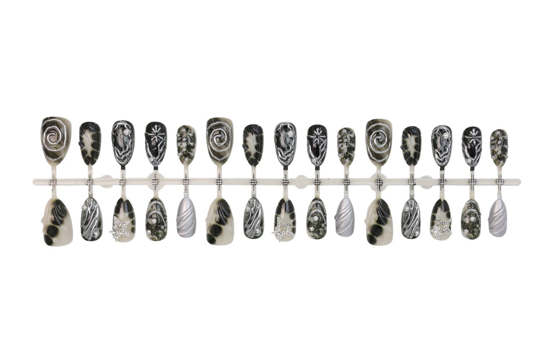 Art nail set with artistic patterns and glitter accents Stornfield