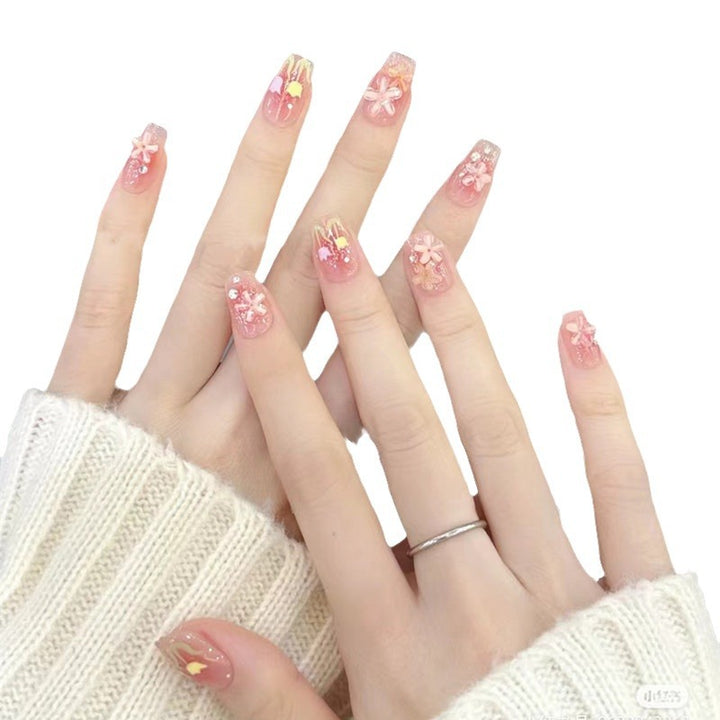 Artificial nails with floral design and glitter effects Stornfield