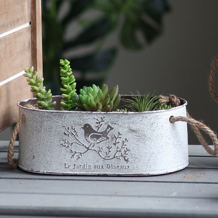 Decorative storage basket made of metal with natural design Stornfield
