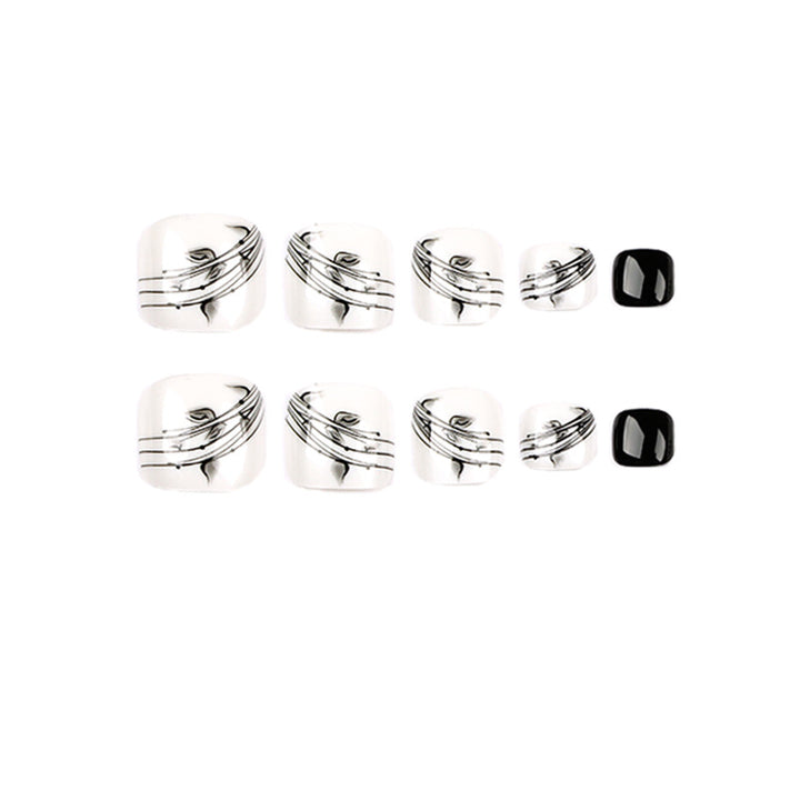 Artful toenail art in elegant black and white design Stornfield