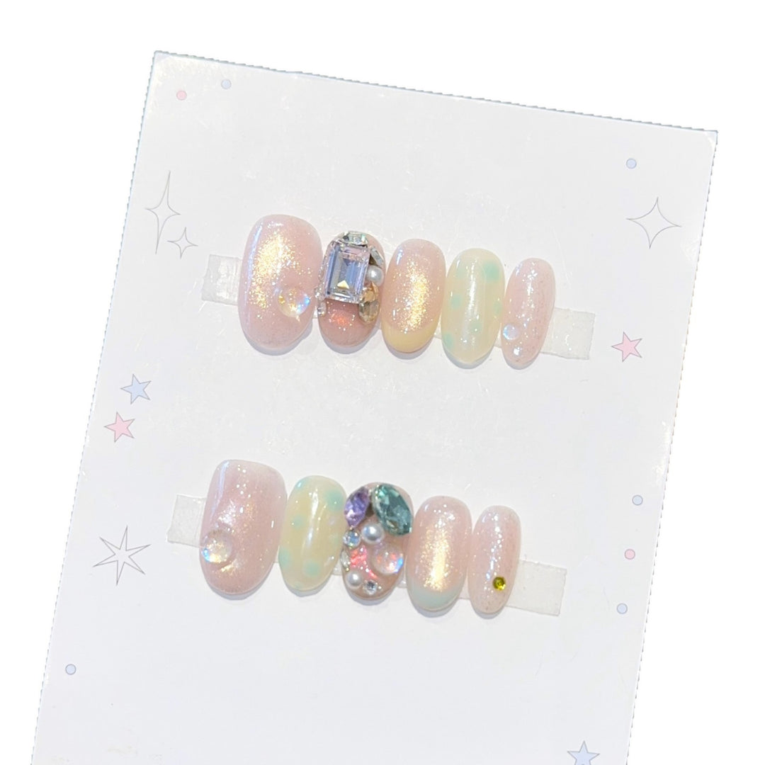 Artificial nails with shimmering effects and crystal accents Stornfield