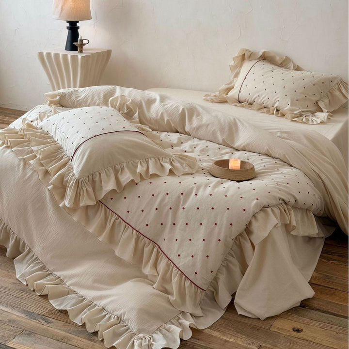 Romantic bedding set with ruffles and delicate dot embroidery