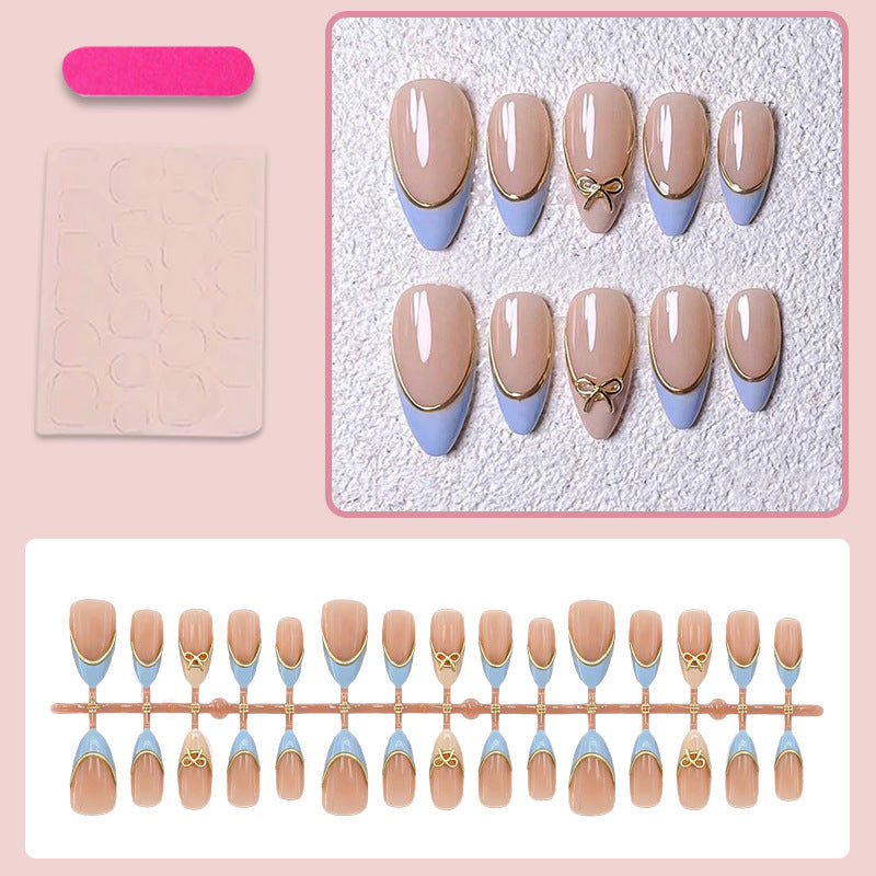 Acrylic nail set with elegant designs and gold accents Stornfield