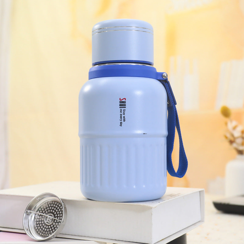 Insulated drinking bottle with integrated carrying strap Stornfield