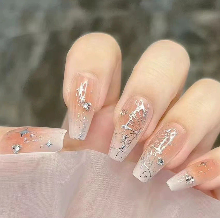 Elegant nail design with pearl embellishment Stornfield