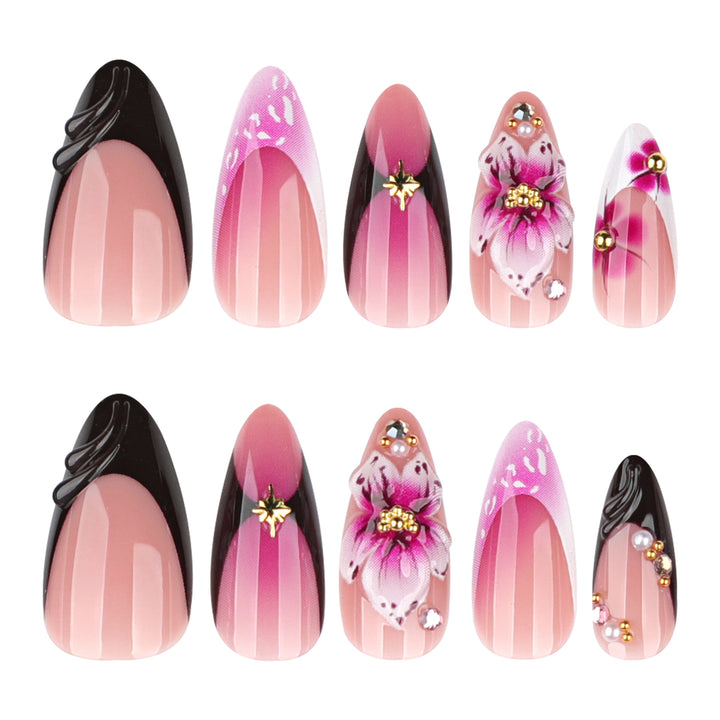 Artful stiletto nails with blooming design and glitter accents Stornfield