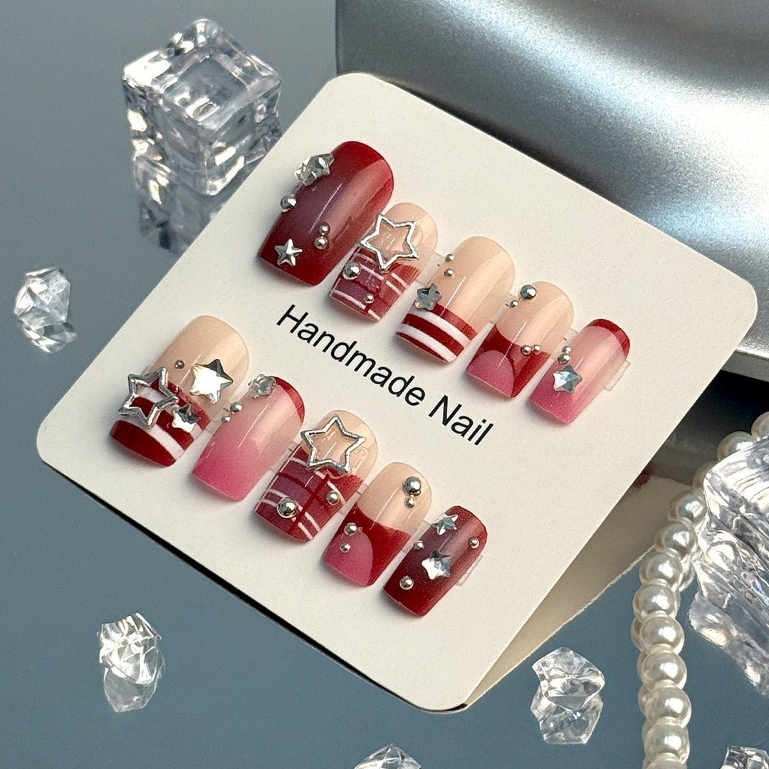 Artificial fingernails with handcrafted star decorations Stornfield