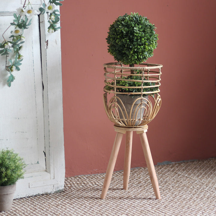 Stylish plant stand made of rattan and wood Stornfield