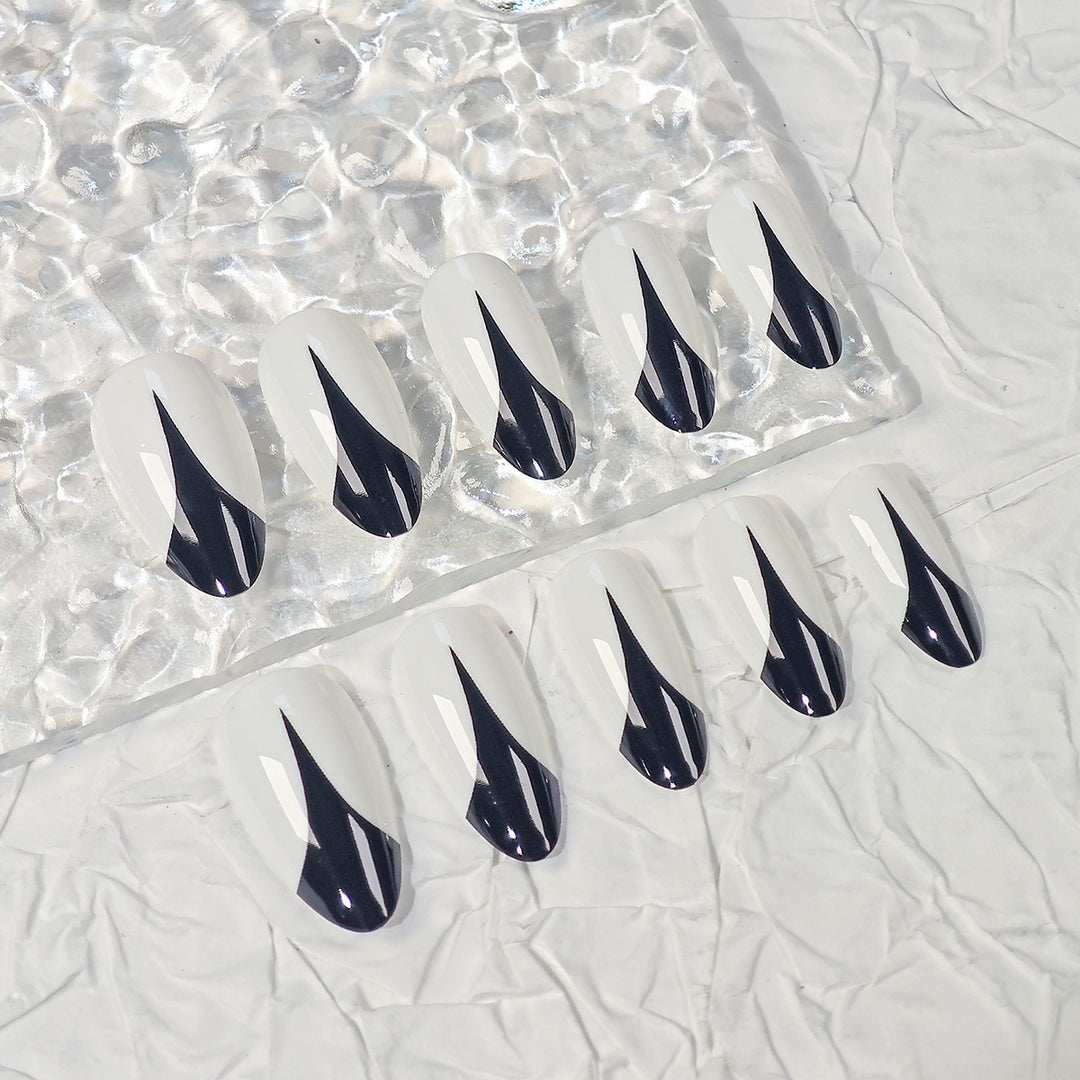 Trendy Stiletto Press-On Nails with Artistic Black and White Design Stornfield