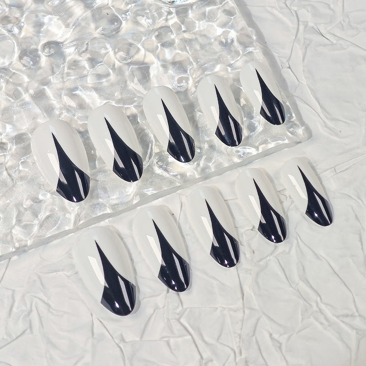 Trendy Stiletto Press-On Nails with Artistic Black and White Design Stornfield