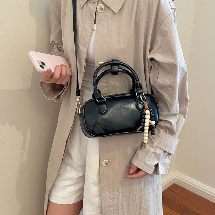 Vintage-Inspired Glossy Handheld Satchel
