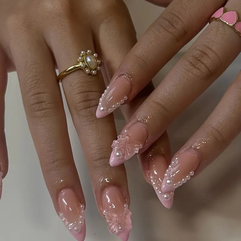 Art nail tips with delicate pearl and butterfly accents Stornfield
