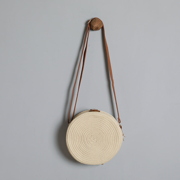 Round shoulder bag made of natural material with stylish accents Stornfield