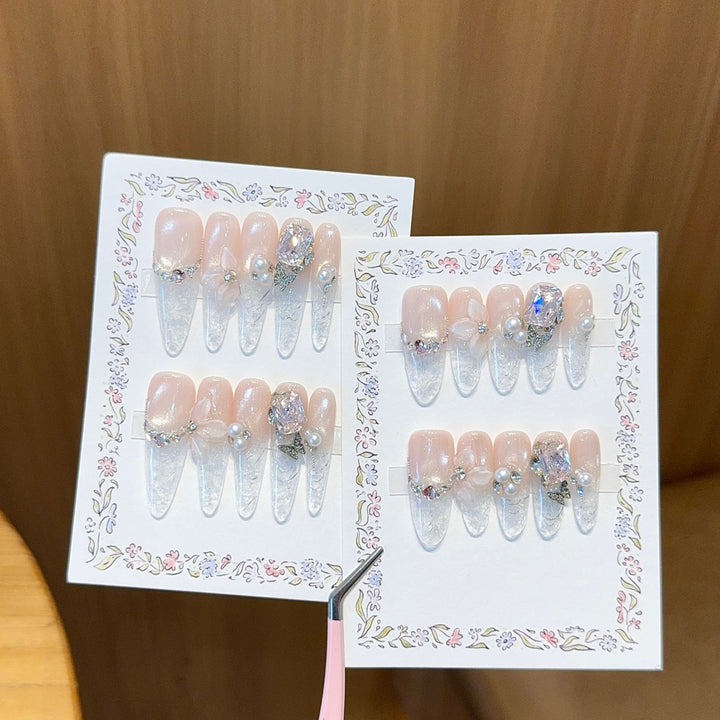 Artificial nails with delicate glitter and pearl decoration Stornfield