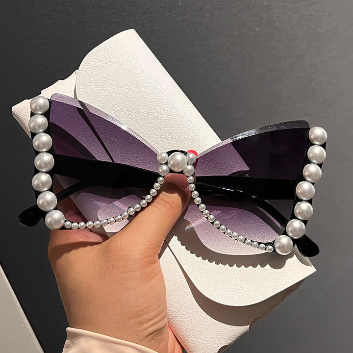 Women striking sunglasses with pearl decoration Stornfield