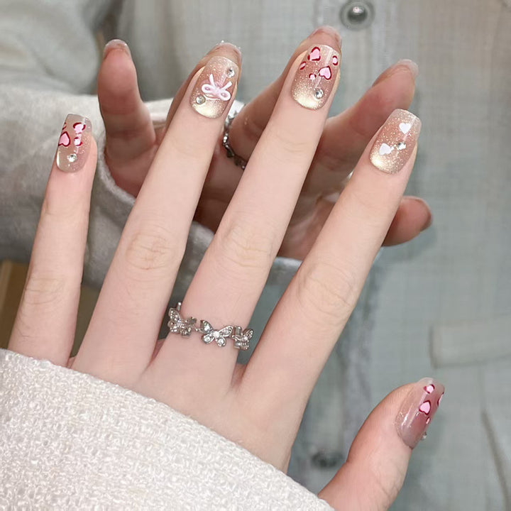 Artistic Press-On Nail Set with Heart and Bow Designs Stornfield