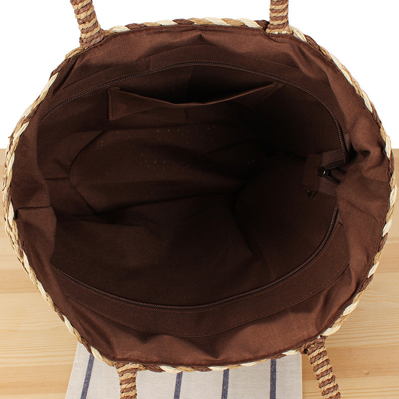 Summer wicker handbag with pom poms Stornfield