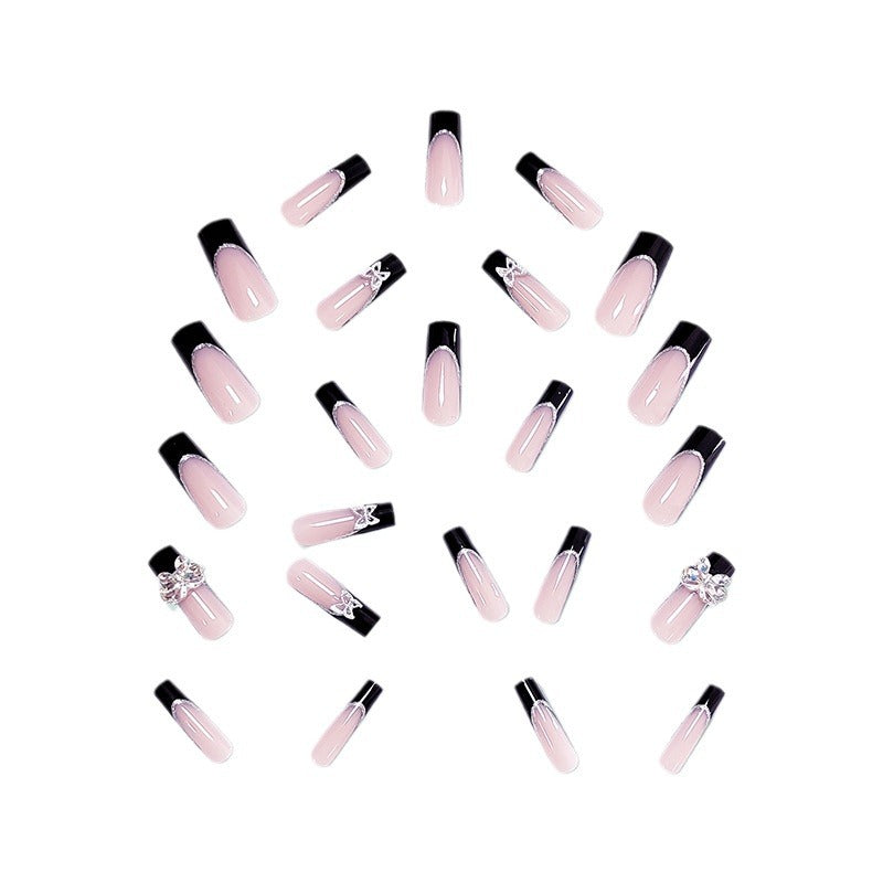 Glamorous artificial nails with rhinestone and butterfly elements Stornfield