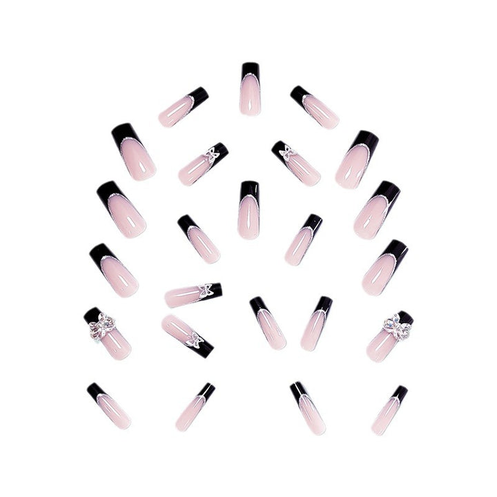 Glamorous artificial nails with rhinestone and butterfly elements Stornfield