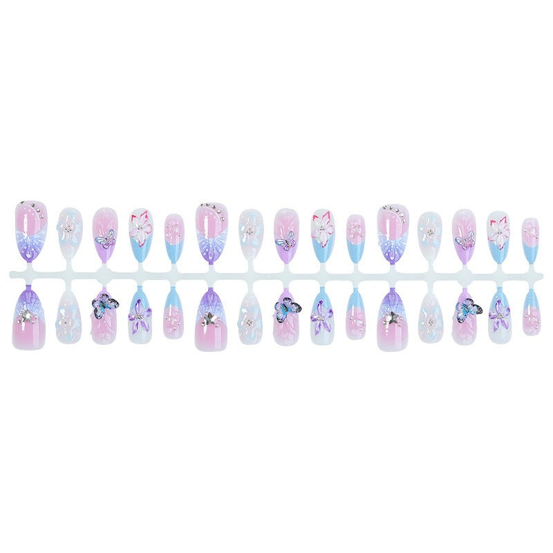 Artificial nail set with floral and glitter details Stornfield