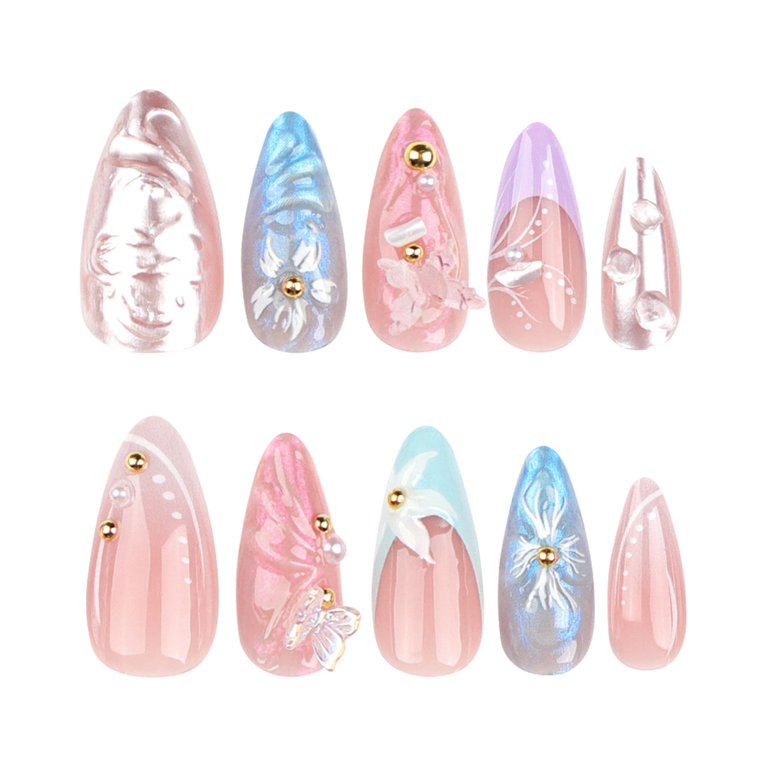 Artistic stiletto nails with delicate flower and glitter embellishments Stornfield