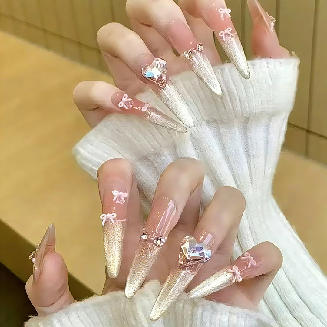 Art nail set with sparkling tips and delicate bow decorations Stornfield
