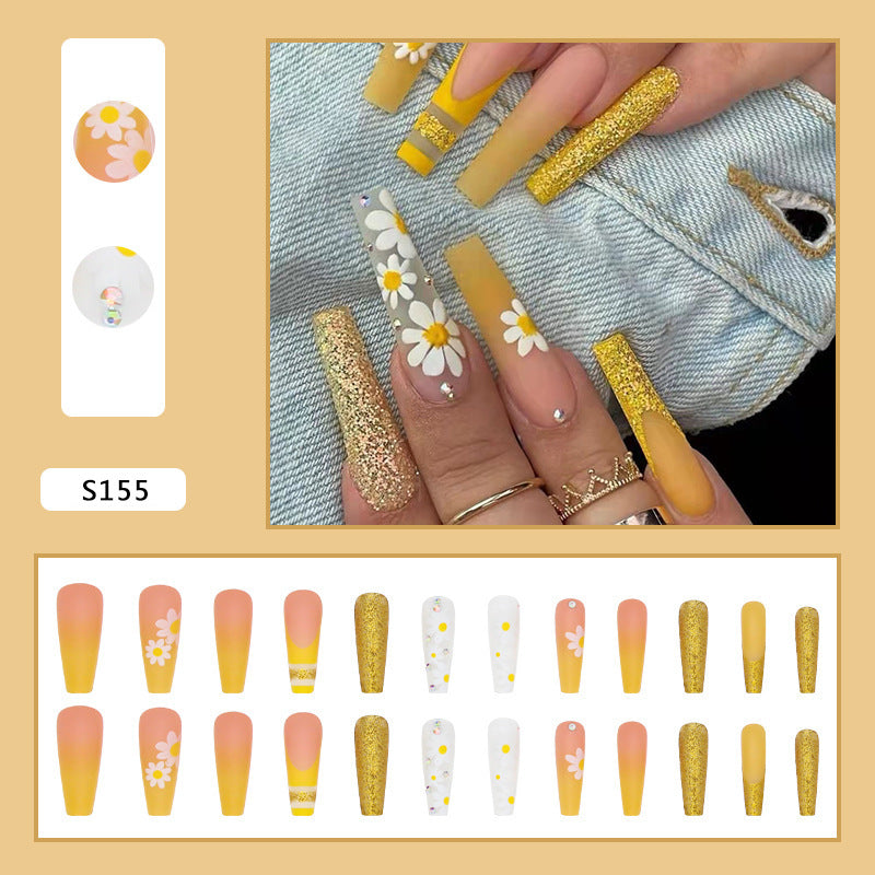 Artificial nail set with colorful sunflower designs and glittering accents Stornfield