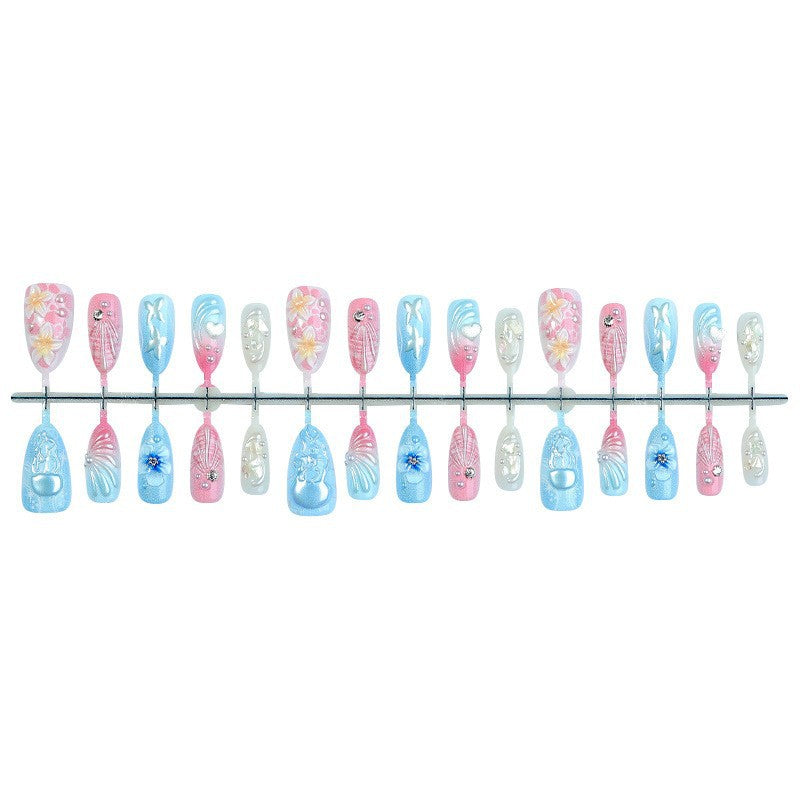 creative nail art set with maritime motifs and sparkling accents Stornfield