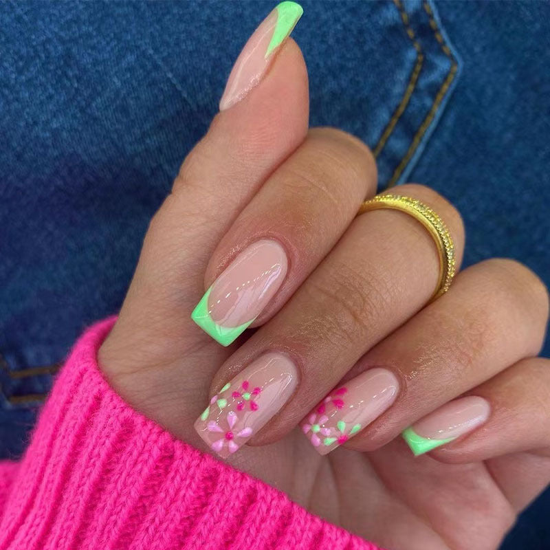 Artificial nails with floral accents and neon tips Stornfield