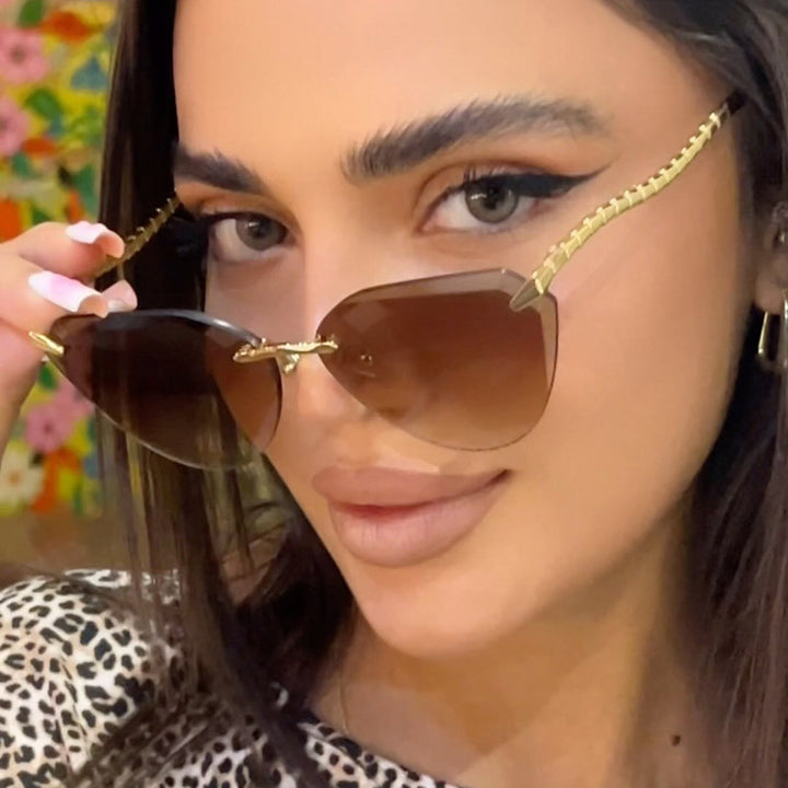 Women's Cat-Eye Sunglasses with unique gold frame design and protective lenses Stornfield