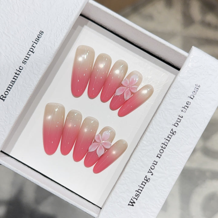 Artificial nails with romantic ombre design and floral accents Stornfield
