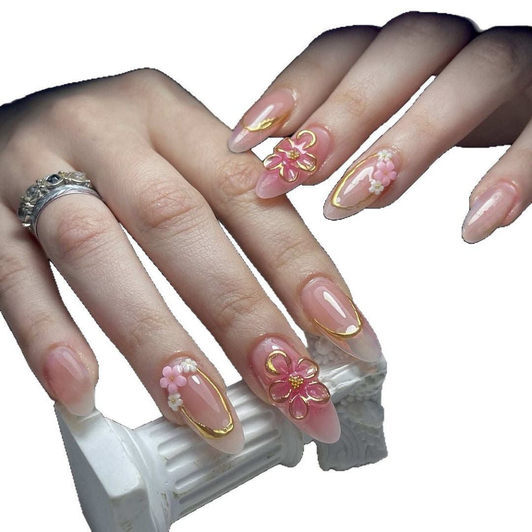 Acrylic nail set with elegant flower and gold decorations Stornfield