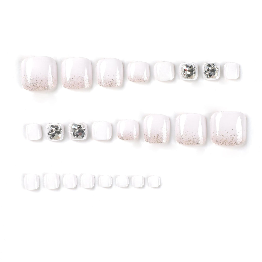 Artful toenail design with sparkling embellishments Stornfield