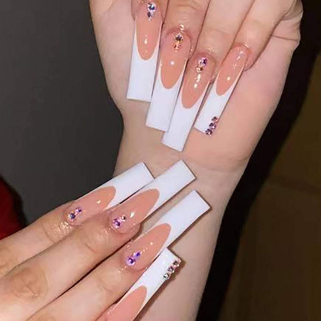 Nail set with elegant French tips and sparkling rhinestone embellishments Stornfield