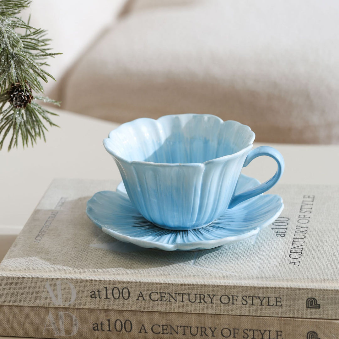 Ceramic mug with saucer in flower shape